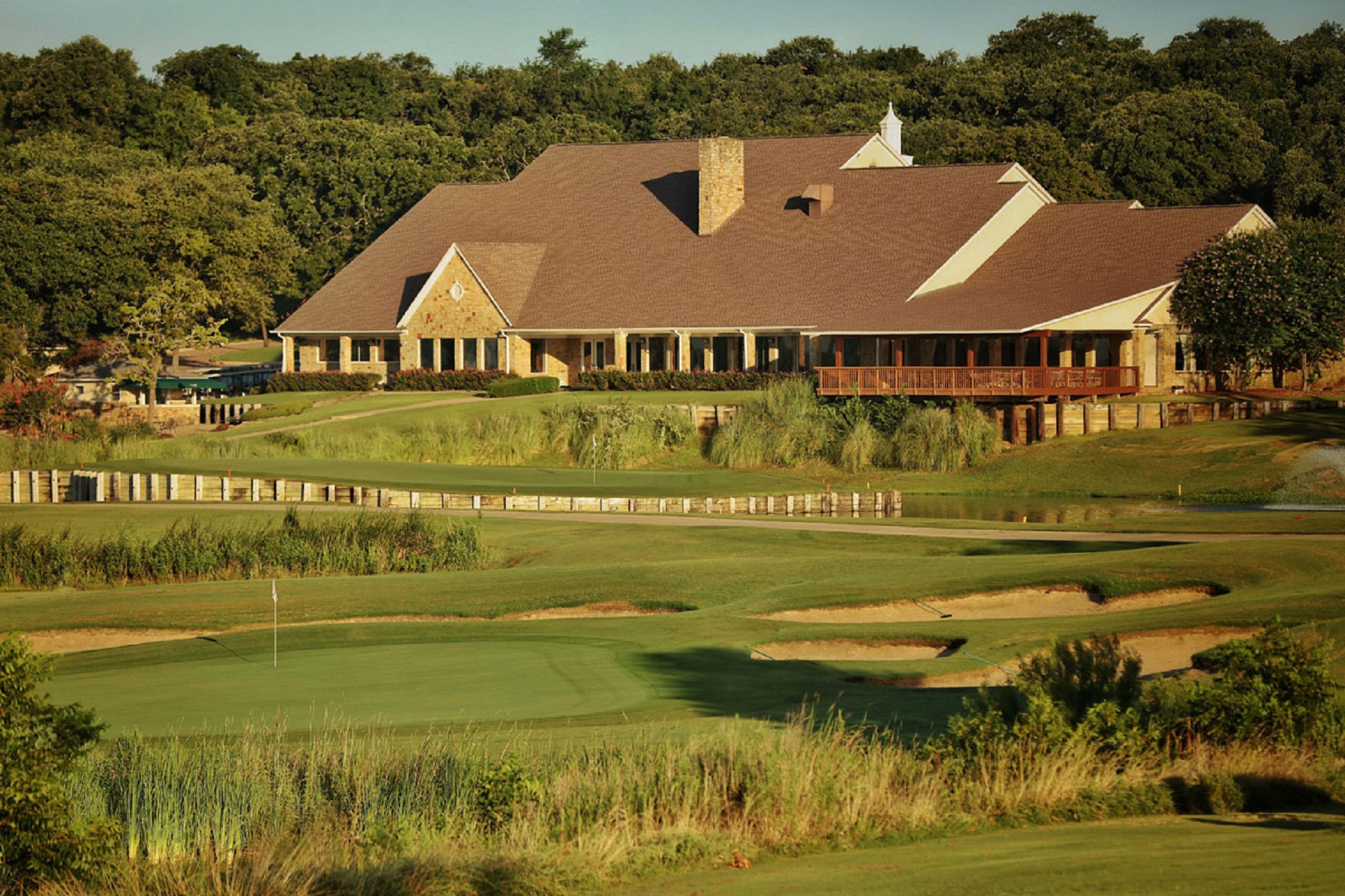 Golf course green with clubhouse